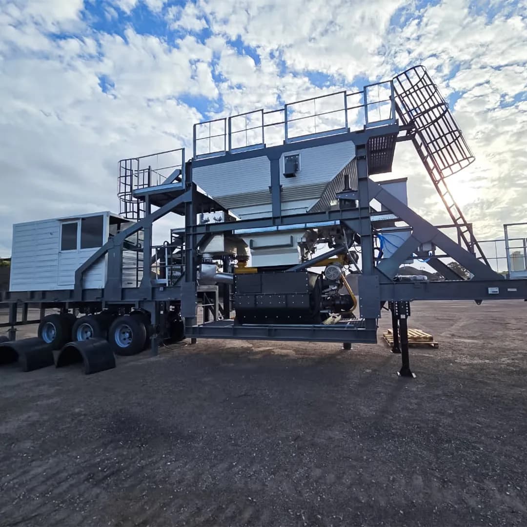 Mobile asphalt plant on a wheeled chassis for relocation between project sites